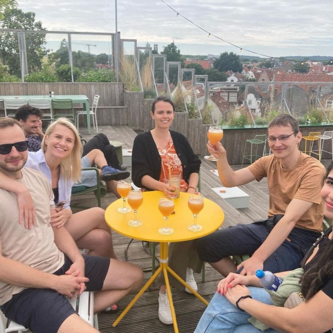 A group having fun and enjoying the view and a drink during the Haarlem Street Food Tour